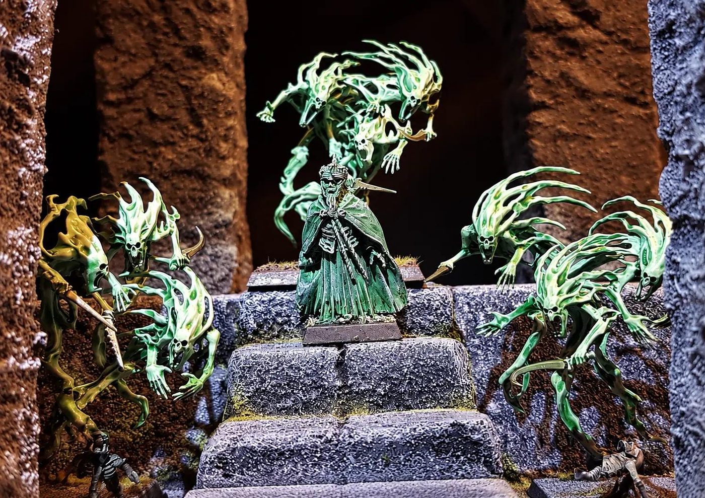 Hand-painted spectral miniatures on stone steps in a dark underworld tabletop scene